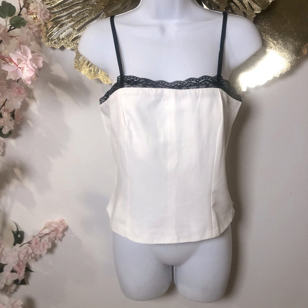 Corset style sleeveless top. With lace trim.